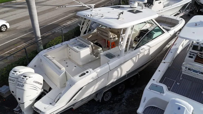 Slide: The Image of 2016 Boston Whaler 320 Vantage boat with twin Mercury outboard engines. - 20