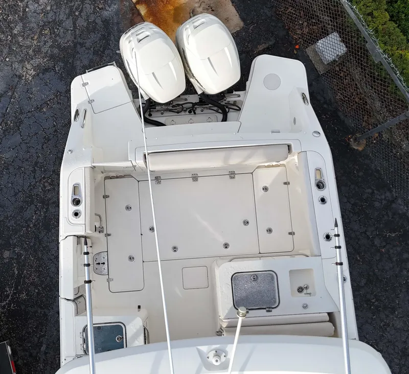 Slide: The Image of Top view of a 2016 Boston Whaler 320 Vantage boat with dual outboard engines. - 3