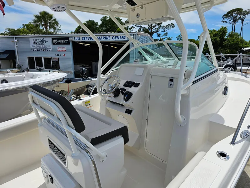 Slide: The Image of 2024 Sailfish 220 WAC boat interior at a marine center. - 4