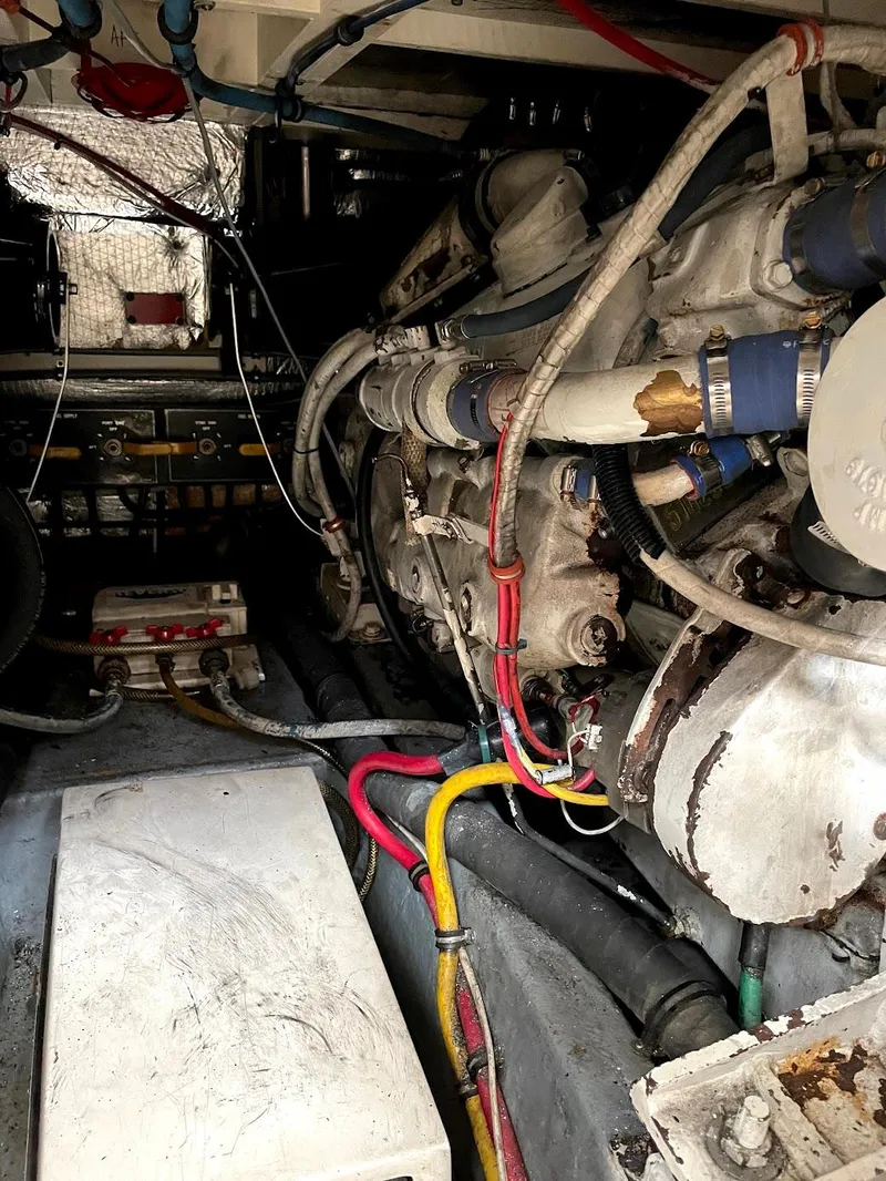 Slide: The Image of Engine room of 1991 Hatteras 40 Motor Yacht with visible wiring and machinery. - 17