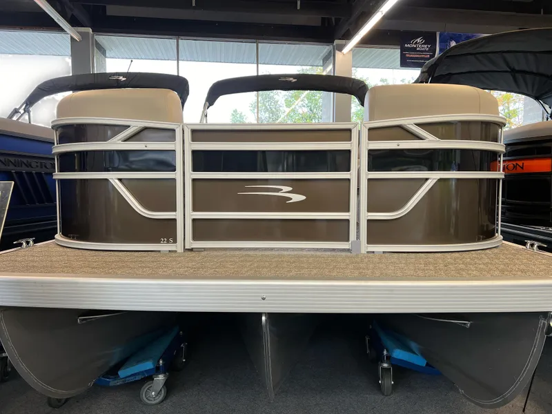 Slide: The Image of 2024 Bennington 22SSR pontoon boat displayed indoors, front view. - 10