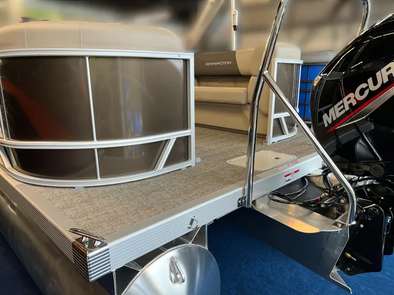 Slide: The Image of 2024 Bennington 22SSR pontoon boat with Mercury engine, featuring sleek design and comfortable seating. - 11