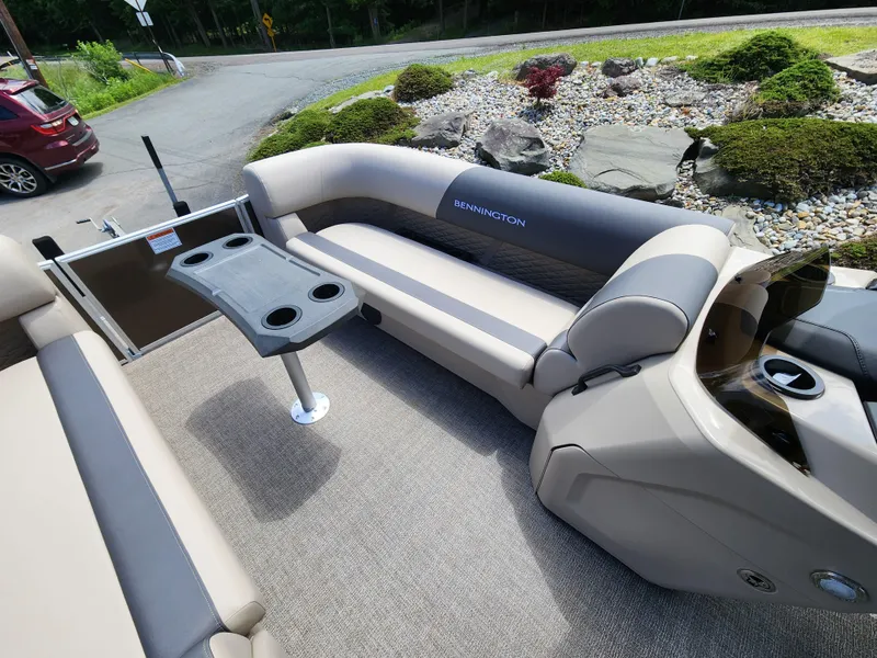 Slide: The Image of 2024 Bennington 22SSR pontoon boat interior with seating and table. - 6