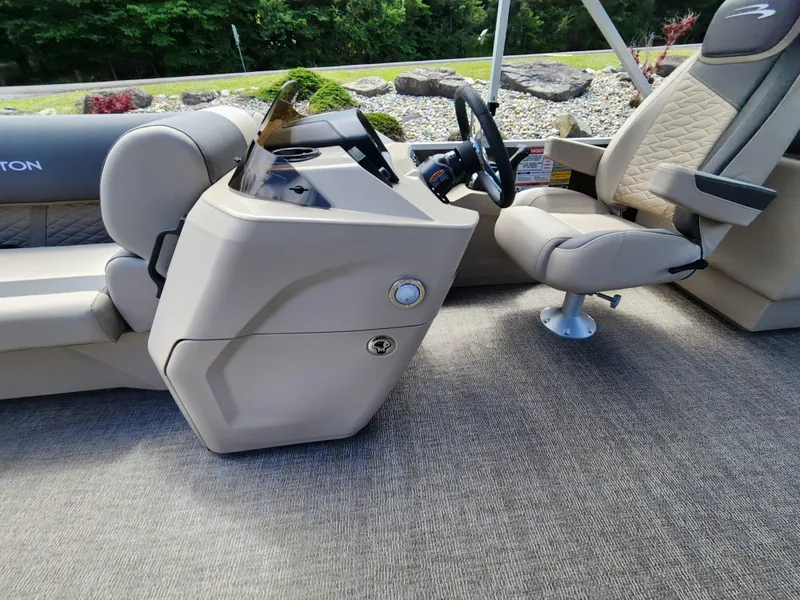 Slide: The Image of 2024 Bennington 22SSR boat interior with steering console and captain's chair. - 7
