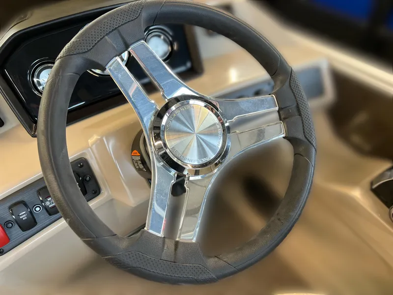 Slide: The Image of 2024 Bennington 22SSR steering wheel, sleek design with chrome accents. - 8
