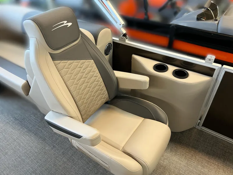 Slide: The Image of 2024 Bennington 22SSR boat seat with quilted design and dual cup holders. - 9