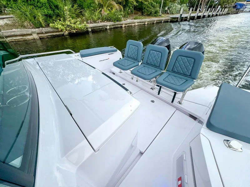Slide: The Image of 2024 Axopar 37XC CROSS CABIN boat with sleek design and comfortable seating. - 16