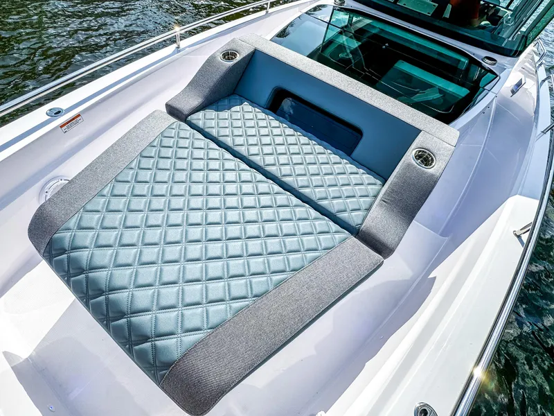 Slide: The Image of 2024 Axopar 37XC CROSS CABIN with luxurious quilted seating on deck. - 21