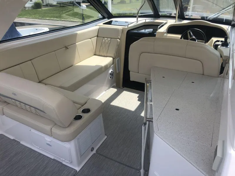 Slide: The Image of Interior of 2020 Regal 35 Sport Coupe with beige seating and modern dashboard. - 14