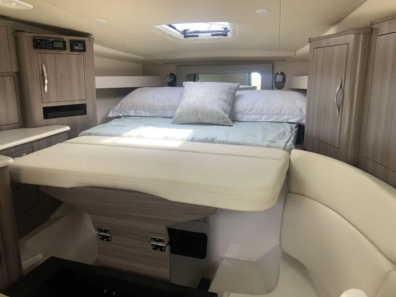 Slide: The Image of Interior cabin of 2020 Regal 35 Sport Coupe with bed and modern cabinetry. - 17