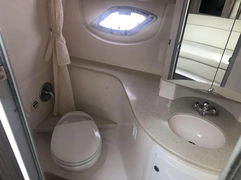 Slide: The Image of Bathroom interior of a 2020 Regal 35 Sport Coupe boat with sink and toilet. - 18