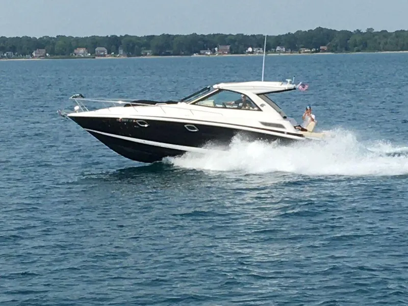 Slide: The Image of 2020 Regal 35 Sport Coupe cruising on a lake. - 2