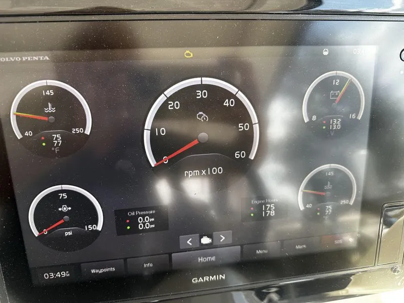 Slide: The Image of Dashboard of a 2020 Regal 35 Sport Coupe showing various engine gauges. - 23