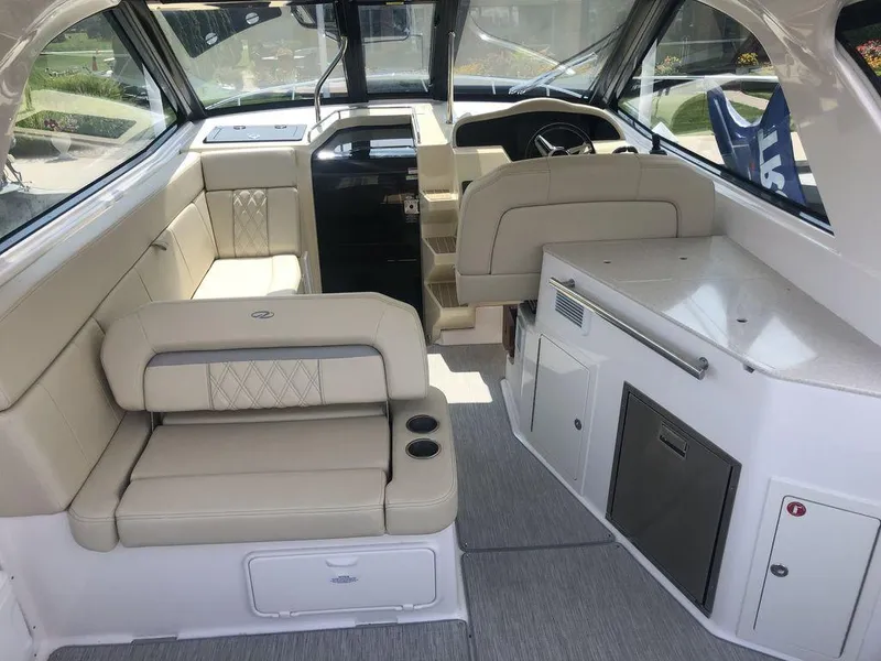Slide: The Image of Interior of 2020 Regal 35 Sport Coupe with beige seating and modern amenities. - 24