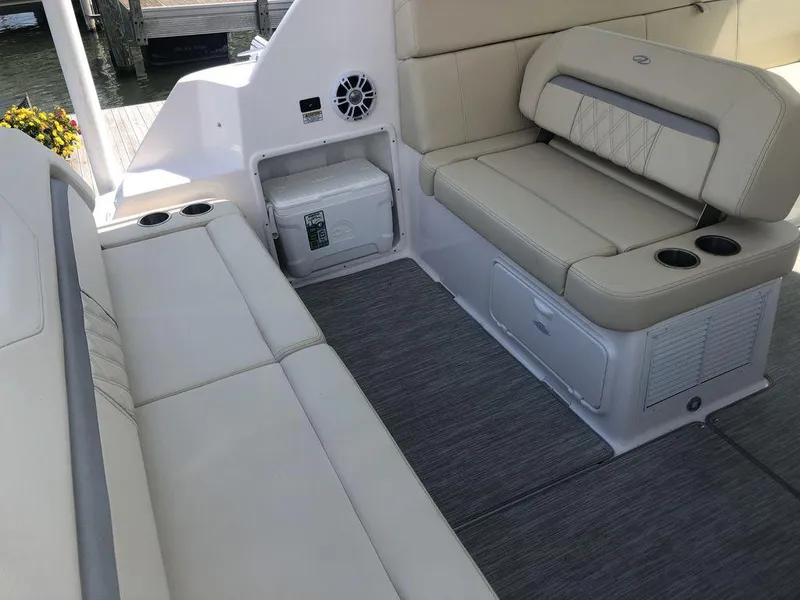 Slide: The Image of Interior seating area of a 2020 Regal 35 Sport Coupe boat with beige upholstery. - 29
