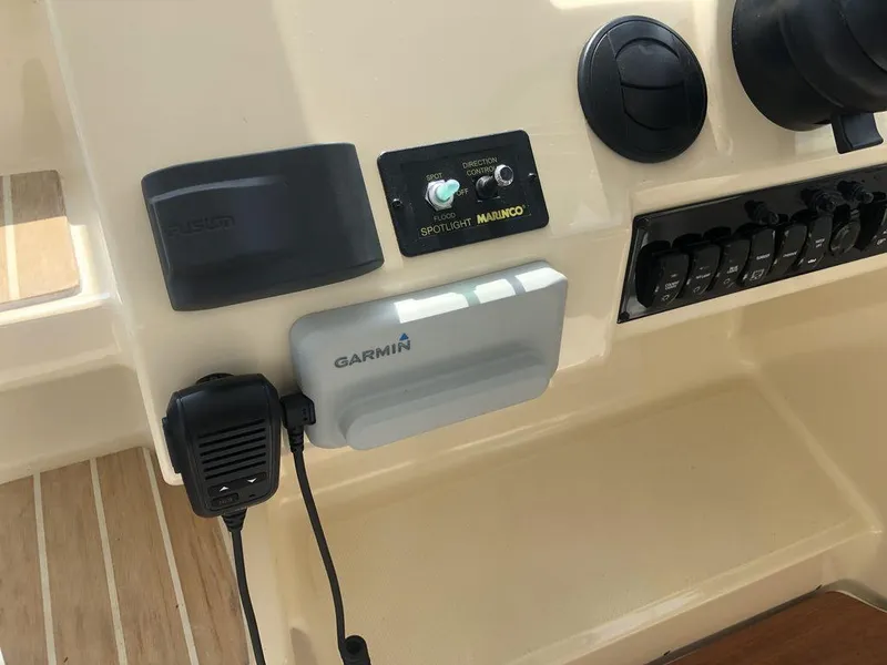 Slide: The Image of Control panel of a 2020 Regal 35 Sport Coupe with Garmin and Fusion devices. - 5