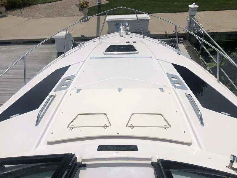 Slide: The Image of 2020 Regal 35 Sport Coupe boat bow view at dock. - 7