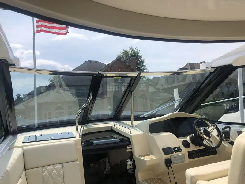 Slide: The Image of Interior view of 2020 Regal 35 Sport Coupe yacht with American flag in background. - 8