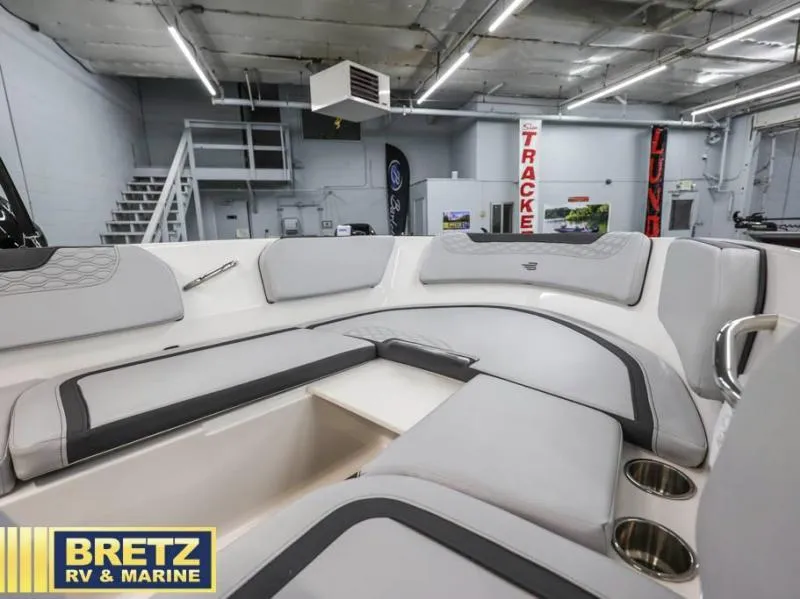Slide: The Image of 2024 Element M15 boat interior with gray seating in showroom. - 11