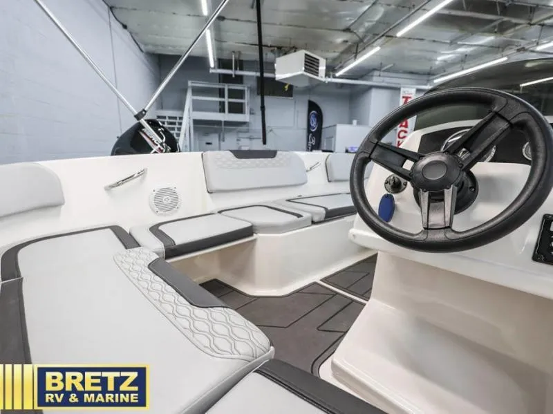 Slide: The Image of 2024 Element M15 boat interior with steering wheel and seating, displayed at Bretz RV & Marine. - 14