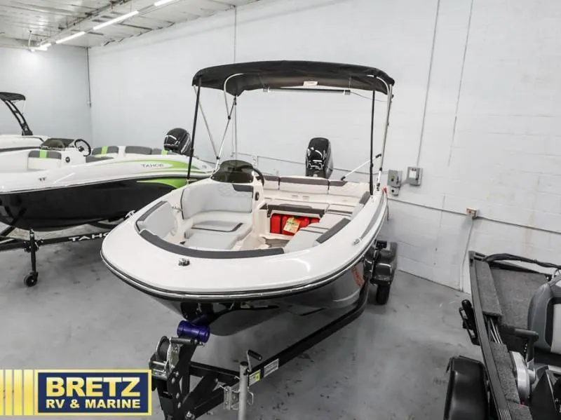 Slide: The Image of 2024 Element M15 boat displayed at Bretz RV & Marine showroom. - 4