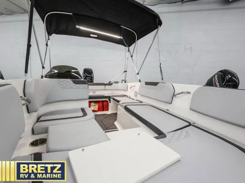 Slide: The Image of 2024 Element M15 boat interior with seating and canopy, displayed at Bretz RV & Marine. - 9