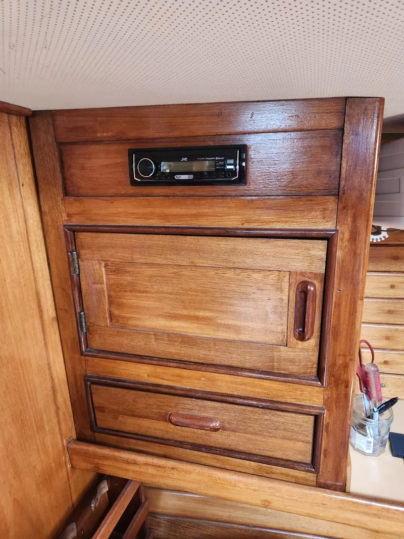 Slide: The Image of 1985 Herreshoff 38 Cat Ketch wooden interior cabinet with built-in stereo. - 30