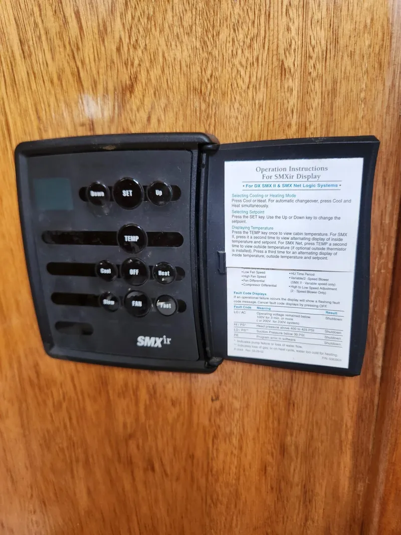 Slide: The Image of 1985 Herreshoff 38 Cat Ketch SMX II control panel with operation instructions. - 37