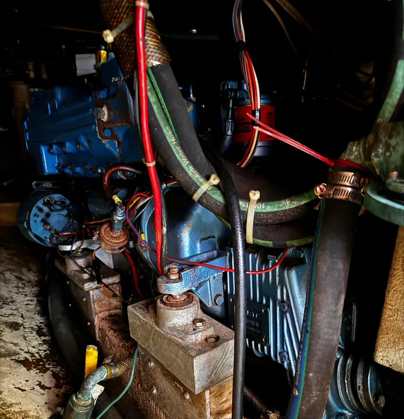 Slide: The Image of Engine compartment of 1985 Herreshoff 38 Cat Ketch with visible wiring and components. - 40