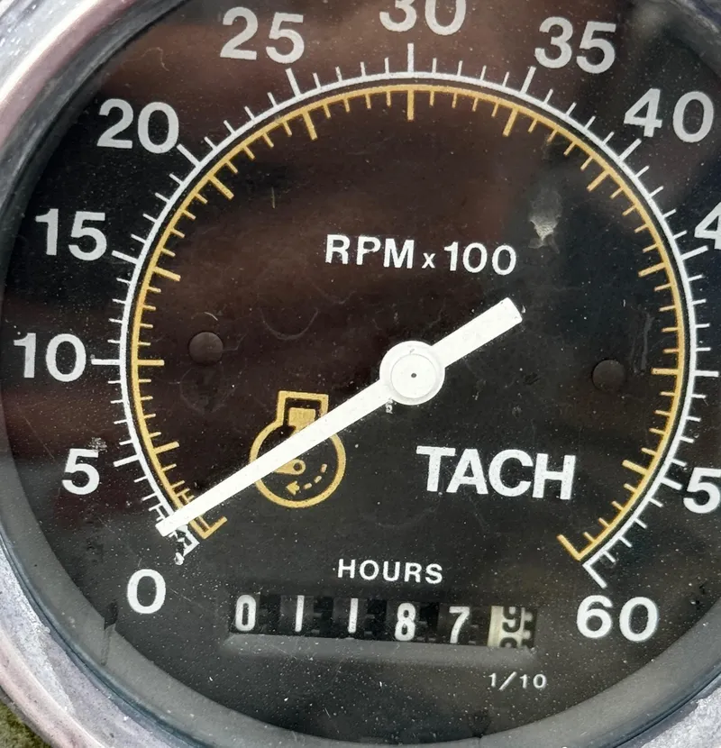 Slide: The Image of Tachometer of 1985 Herreshoff 38 Cat Ketch showing RPM and hours. - 43