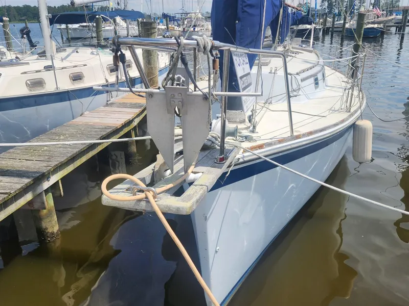 Slide: The Image of 1985 Herreshoff 38 Cat Ketch sailboat docked at a marina. - 6