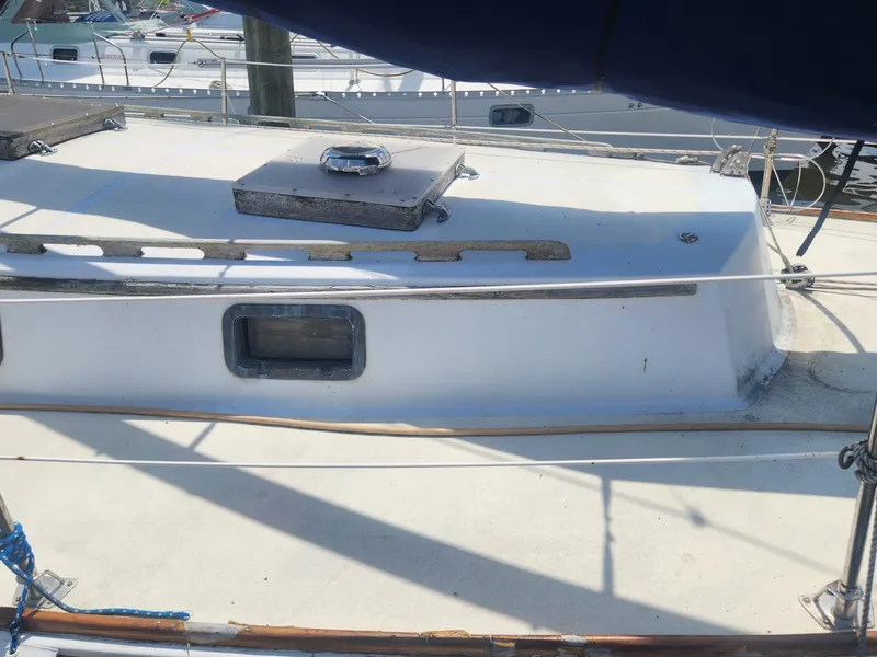 Slide: The Image of 1985 Herreshoff 38 Cat Ketch deck view with hatch and window. - 9