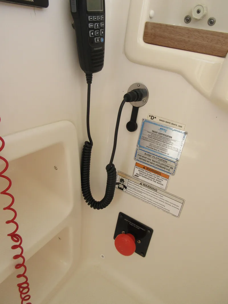 Slide: The Image of 2016 Grady-White Freedom 307 boat communication equipment and safety controls. - 19