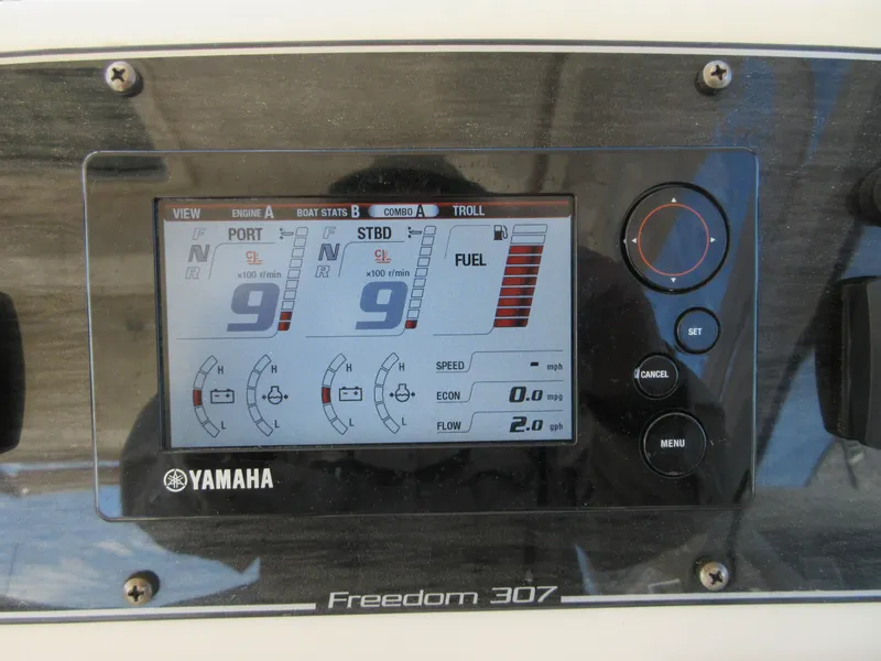 Slide: The Image of Yamaha engine display on 2016 Grady-White Freedom 307 boat dashboard. - 22
