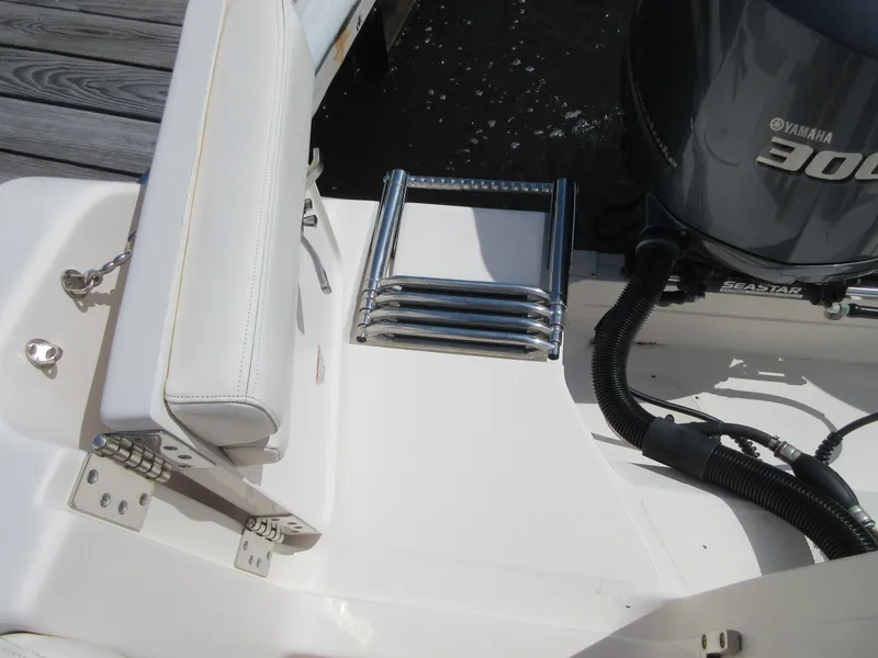Slide: The Image of 2016 Grady-White Freedom 307 boat with Yamaha 300 outboard motor and swim ladder. - 25