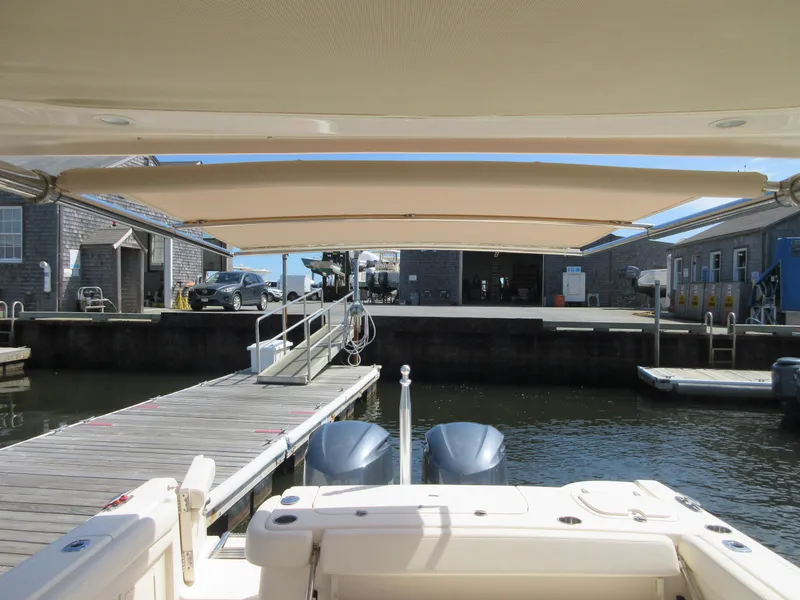 Slide: The Image of 2016 Grady-White Freedom 307 at dock with twin outboard engines. - 28