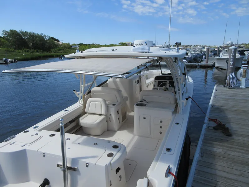 Slide: The Image of 2016 Grady-White Freedom 307 boat docked at a marina. - 30