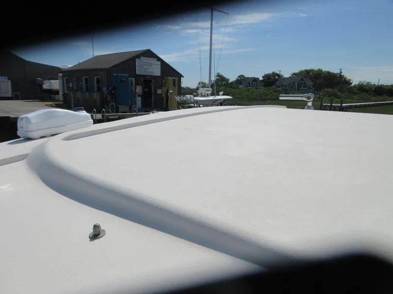 Slide: The Image of 2016 Grady-White Freedom 307 boat deck at a marina. - 4