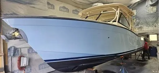 Slide: The Image of 2016 Grady-White Freedom 307 boat in a workshop setting. - 41