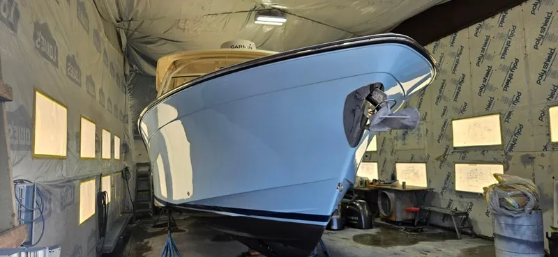 Slide: The Image of 2016 Grady-White Freedom 307 boat in a workshop, under maintenance. - 42