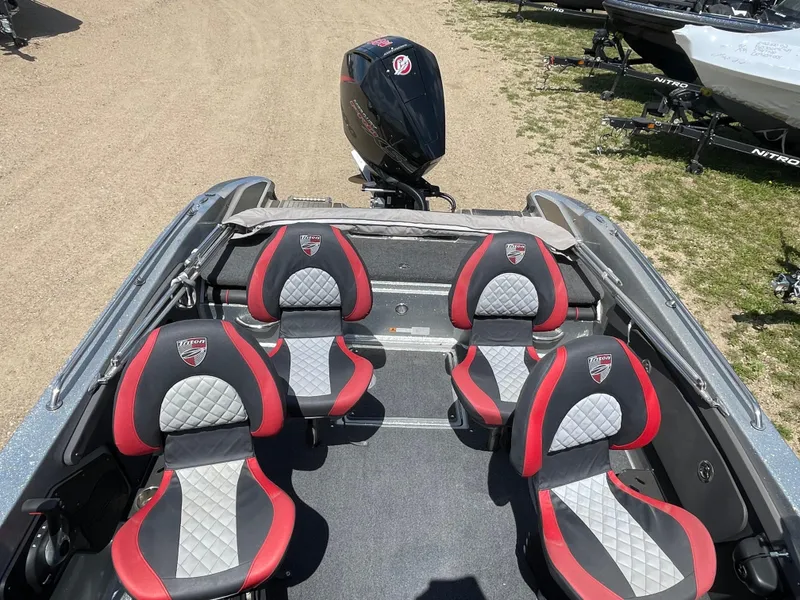 Slide: The Image of 2022 Triton 206 Allure boat interior with four red and gray seats. - 19