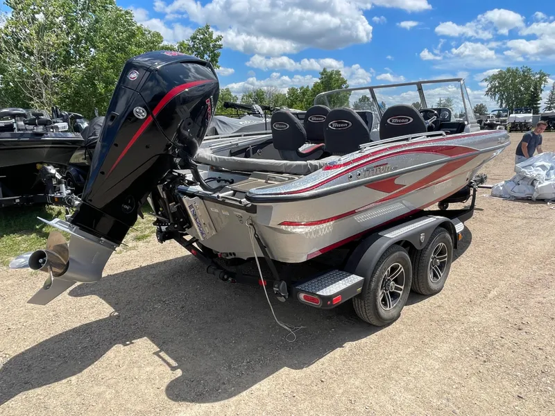 Slide: The Image of 2022 Triton 206 Allure boat with outboard motor on a trailer. - 3