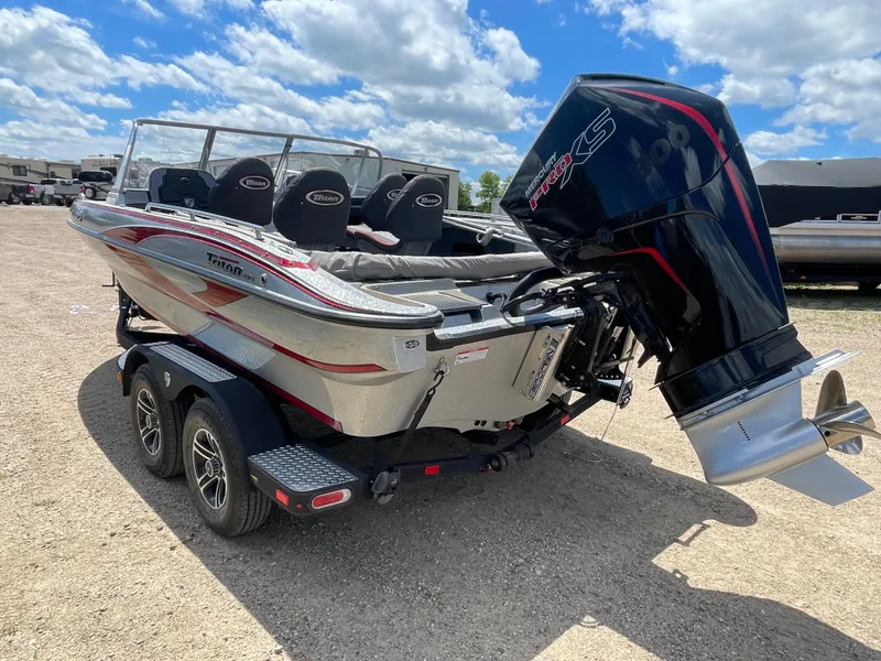 Slide: The Image of 2022 Triton 206 Allure boat with powerful outboard motor on a trailer. - 4