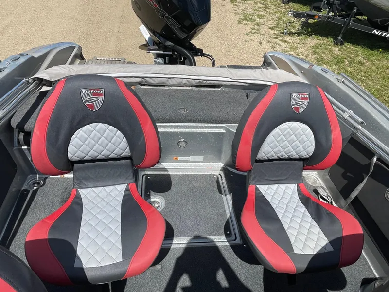 Slide: The Image of 2022 Triton 206 Allure boat seats, black and red with diamond stitching. - 9