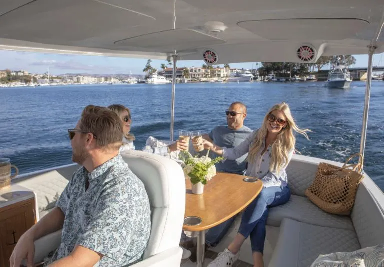 Slide: The Image of Group enjoying a ride on a 2026 Duffy Balboa 20' boat. - 6