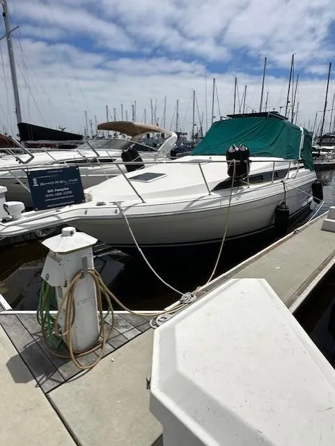 The Image of 1996 Wellcraft 3200 Martinique boat docked at marina. - 0