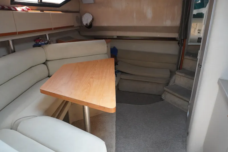 Slide: The Image of Interior of 1996 Wellcraft 3200 Martinique with seating area and table. - 24