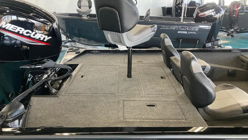 Slide: The Image of 2024 Crestliner XFC 189 fishing boat interior with Mercury engine and seating arrangement. - 10