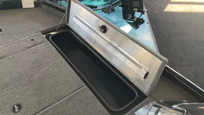 Slide: The Image of 2024 Crestliner XFC 189 boat storage compartment with open lid, showcasing interior space. - 14