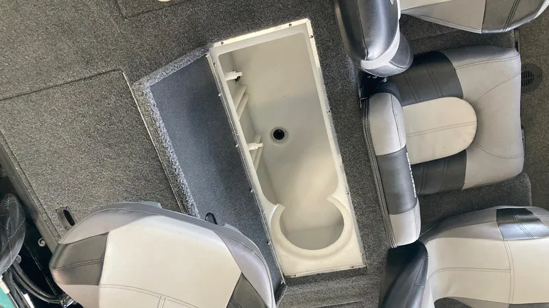 Slide: The Image of 2024 Crestliner XFC 189 boat interior with seating and storage compartment. - 15